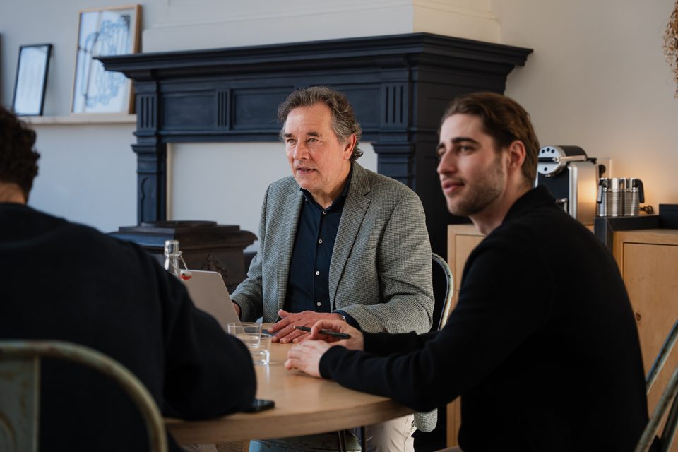 Adviser and entrepreneur in discussion at the meeting table