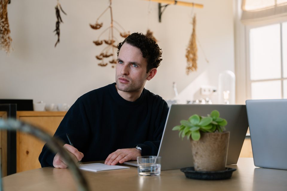 Entrepreneur and adviser reviewing the bookkeeping together on a laptop